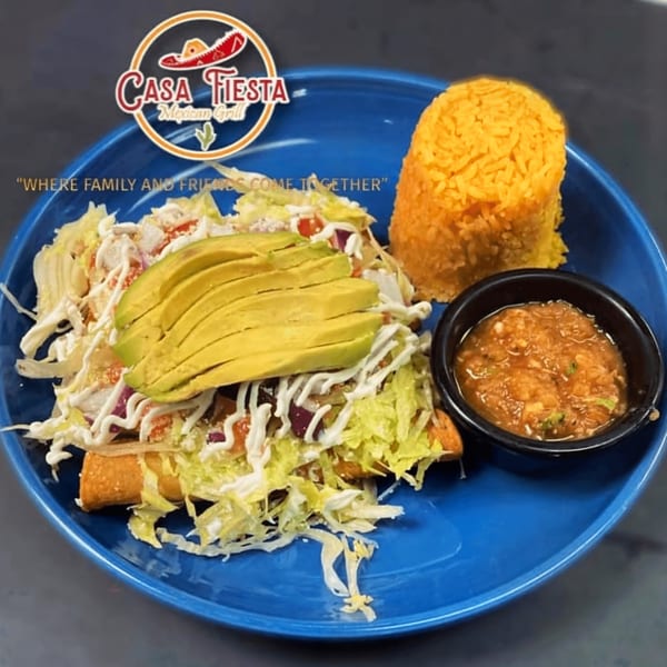 Casa Fiesta Mexican Grill's taquitos with lettuce, avocado, sour cream, rice, and salsa on a blue plate.
